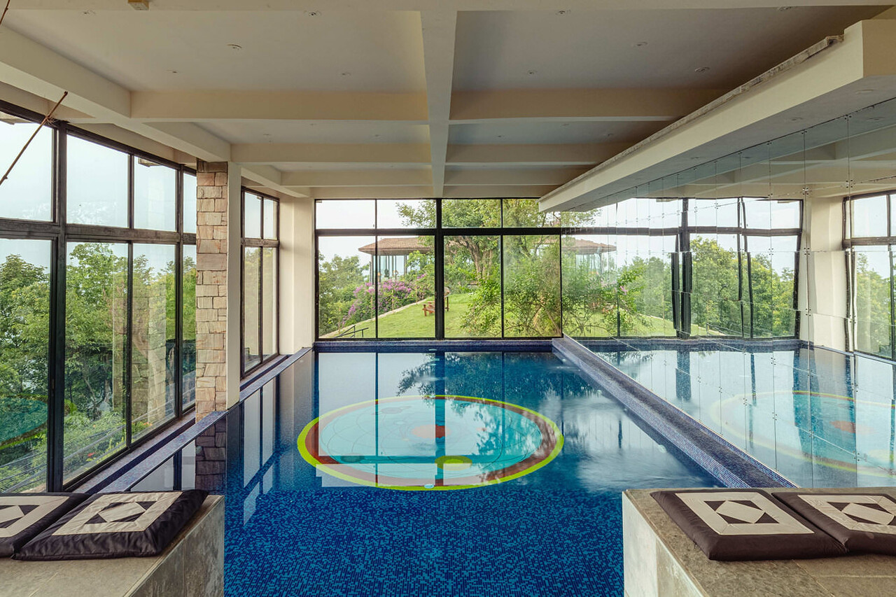Brahmanda Indoor Pool beneath a vaulted ceiling with constellation-like lighting