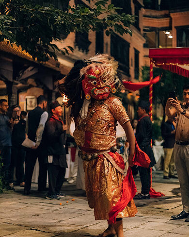 Traditional masked dancer performing Lakhe dance